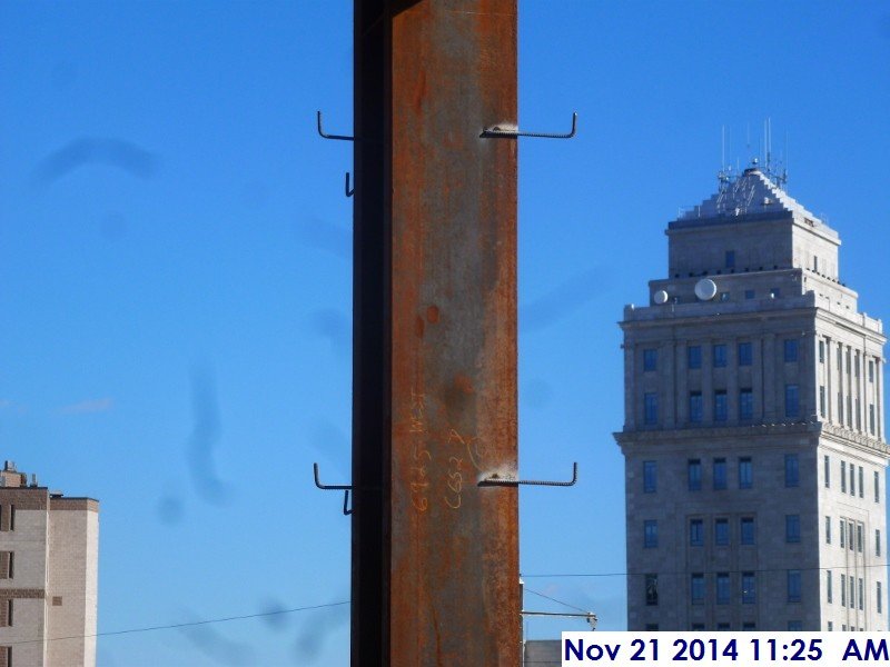 Welded metal clips along column H-1 Facing East
